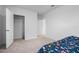 Bright bedroom with carpeted floor and a bed at 821 Sun Burst Rd, Winter Haven, FL 33880
