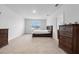 Spacious main bedroom with large window and dresser at 821 Sun Burst Rd, Winter Haven, FL 33880
