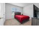 Bedroom with double bed, TV, and window with blinds at 821 Sun Burst Rd, Winter Haven, FL 33880