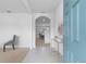 Bright entryway with tiled floor, gold console table, and view into living room at 821 Sun Burst Rd, Winter Haven, FL 33880