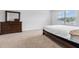 Bedroom with large dresser and window at 821 Sun Burst Rd, Winter Haven, FL 33880
