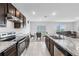 Open concept kitchen with island and stainless steel appliances at 821 Sun Burst Rd, Winter Haven, FL 33880