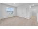 Spacious bedroom with carpeted floor and a window at 821 Sun Burst Rd, Winter Haven, FL 33880