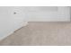 Simple bedroom with carpeted floor and a door at 821 Sun Burst Rd, Winter Haven, FL 33880