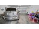 Garage with car, shelving and toys at 821 Sun Burst Rd, Winter Haven, FL 33880