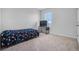 Cozy bedroom with carpeted floor, a bed, and a TV at 821 Sun Burst Rd, Winter Haven, FL 33880