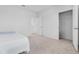 Bright bedroom with carpeted floor, a double door closet and a window at 821 Sun Burst Rd, Winter Haven, FL 33880