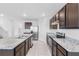 Open kitchen with granite countertops and stainless steel appliances at 821 Sun Burst Rd, Winter Haven, FL 33880