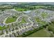 Aerial view of a sprawling residential area featuring houses, roads, and green spaces at 821 Sun Burst Rd, Winter Haven, FL 33880