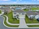 Two-story house in a residential neighborhood with a curved sidewalk at 821 Sun Burst Rd, Winter Haven, FL 33880