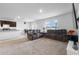 Relaxing living room with plush gray sofas and a large TV at 821 Sun Burst Rd, Winter Haven, FL 33880