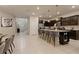 Modern kitchen with stainless steel appliances and an island at 3625 Lily Ln, Davenport, FL 33897