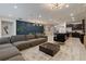 Spacious living room with sectional sofa and large coffee table at 3625 Lily Ln, Davenport, FL 33897