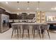 Modern kitchen with island, stainless steel appliances, and pendant lighting at 3625 Lily Ln, Davenport, FL 33897