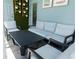 Outdoor patio furniture with seating and a coffee table at 3625 Lily Ln, Davenport, FL 33897