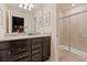 Modern bathroom featuring a double vanity and shower at 3625 Lily Ln, Davenport, FL 33897