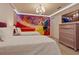Charming bedroom with twin beds and Beauty and the Beast theme at 3625 Lily Ln, Davenport, FL 33897