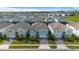 Community view showcasing multiple two story houses at 3625 Lily Ln, Davenport, FL 33897