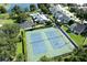 Two tennis courts in a residential community near a lake at 3240 W Saint Brides Cir, Orlando, FL 32812