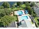 Aerial view of community pool with a playground and ample lounge space at 3240 W Saint Brides Cir, Orlando, FL 32812