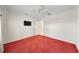 Bedroom with red carpet and ceiling fan at 16950 Se 80Th Bellavista Cir, The Villages, FL 32162