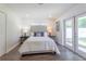 Main bedroom with plush carpeting and sliding glass doors leading to the backyard at 905 Marabon Ave, Orlando, FL 32806