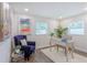 Home office with hardwood floors, neutral walls, and built-in desk at 905 Marabon Ave, Orlando, FL 32806