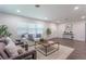 Living room with hardwood floors, neutral decor, and ample natural light at 905 Marabon Ave, Orlando, FL 32806