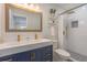 Modern bathroom with double vanity, white subway tile, and gold fixtures at 905 Marabon Ave, Orlando, FL 32806