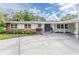 Ranch-style home with brick accents and landscaped yard at 905 Marabon Ave, Orlando, FL 32806