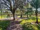 playground with play structures, shaded areas, and benches at 1831 Waterside Oaks Dr, Orange City, FL 32763