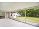 Screened porch with view of backyard and detached garage at 1410 Corbett Ln, Orlando, FL 32806