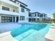 Luxury pool and spa with surrounding patio at 1020 Jack Nicklaus Ct, Kissimmee, FL 34747