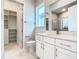 Modern bathroom with white vanity and walk-in shower at 1020 Jack Nicklaus Ct, Kissimmee, FL 34747