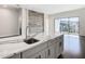 Modern kitchen island with white quartz countertop and stainless steel sink at 1020 Jack Nicklaus Ct, Kissimmee, FL 34747