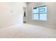 Bright bedroom with large window and plush carpeting at 1020 Jack Nicklaus Ct, Kissimmee, FL 34747