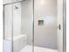 Clean shower with tiled walls and built-in seat at 1020 Jack Nicklaus Ct, Kissimmee, FL 34747