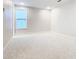 Spacious bedroom with neutral carpeting and large window at 1020 Jack Nicklaus Ct, Kissimmee, FL 34747
