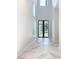 Bright entryway with marble floors and black-framed doors at 1020 Jack Nicklaus Ct, Kissimmee, FL 34747