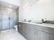 Modern bathroom with double vanity and shower at 1020 Jack Nicklaus Ct, Kissimmee, FL 34747