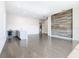 Spacious living area with wood-look tile flooring and a statement wall at 1020 Jack Nicklaus Ct, Kissimmee, FL 34747
