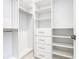 Spacious closet with hanging rods and shelves at 1020 Jack Nicklaus Ct, Kissimmee, FL 34747