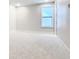 Well-lit bedroom with carpet and a window at 1020 Jack Nicklaus Ct, Kissimmee, FL 34747