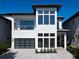Modern two-story home with gray-brick facade and attached garage at 1020 Jack Nicklaus Ct, Kissimmee, FL 34747
