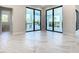 Gathering room with access to pool area through sliding doors at 1020 Jack Nicklaus Ct, Kissimmee, FL 34747