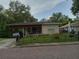 One-story house with brick driveway and fenced yard at 522 W Park St, Lakeland, FL 33803