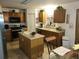 Kitchen with island, ample cabinetry, and modern appliances at 15507 Willet Ct, Mascotte, FL 34753