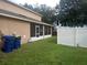 Backyard with grassy area and privacy fence at 15507 Willet Ct, Mascotte, FL 34753