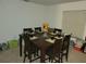Casual dining area with table and chairs for six at 15507 Willet Ct, Mascotte, FL 34753