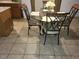 Small dining area with glass-top table and four chairs at 15507 Willet Ct, Mascotte, FL 34753
